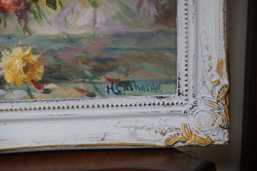 A decorative oil on board, Still life of flowers in a vase, 49 x 74cm. Condition - good
